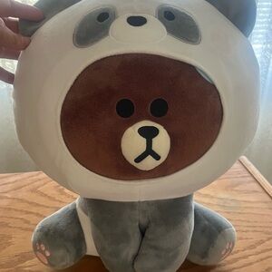 Bear dressed as a panda plushie.